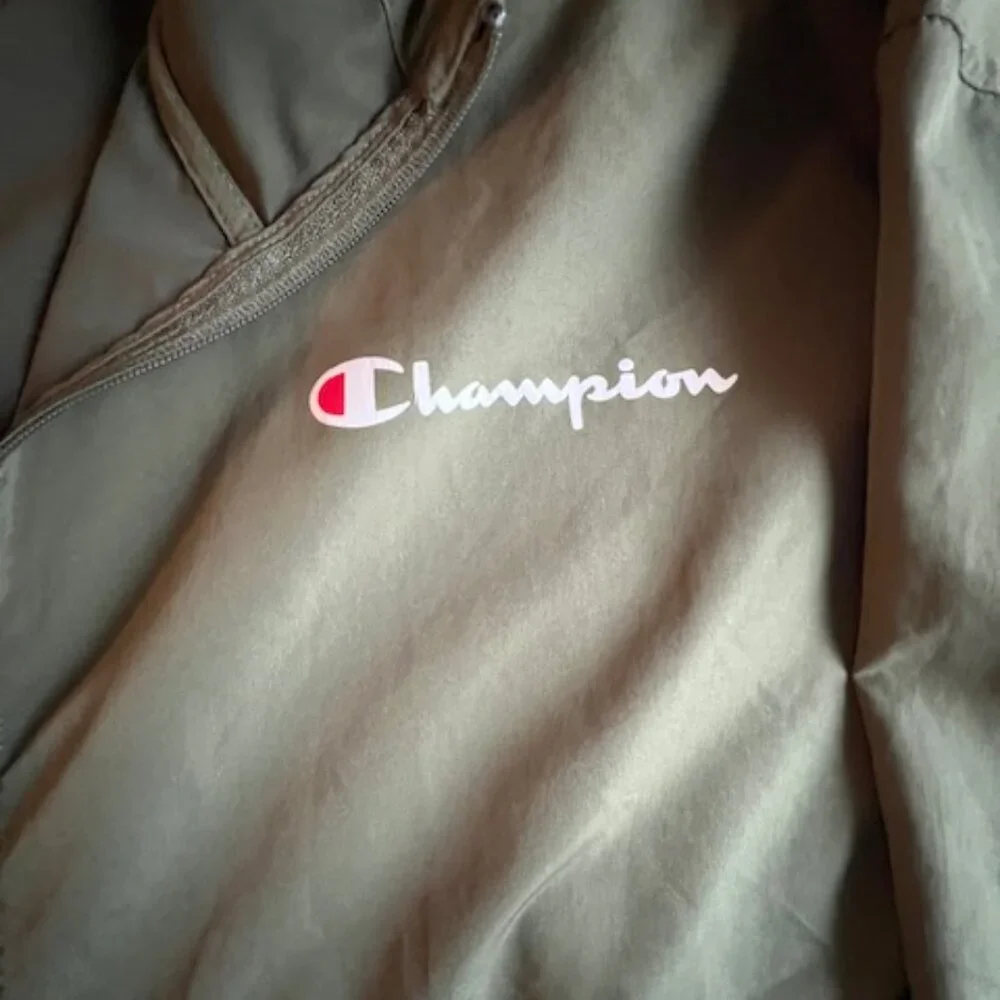 Champion olive green windbreaker jacket half-zip front, bungee cord hood Mens XL